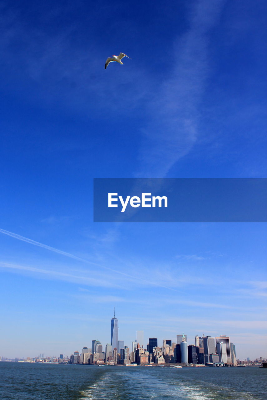 Scenic view of sea against blue sky