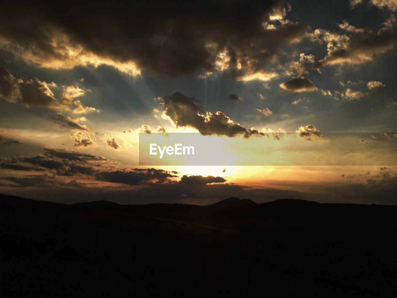 Scenic view of dramatic sky during sunset