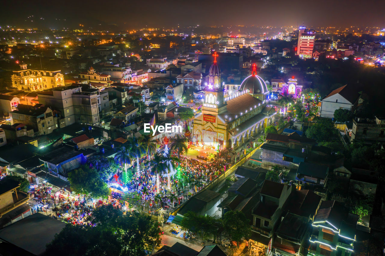 Aerial view of illuminated buildings in city