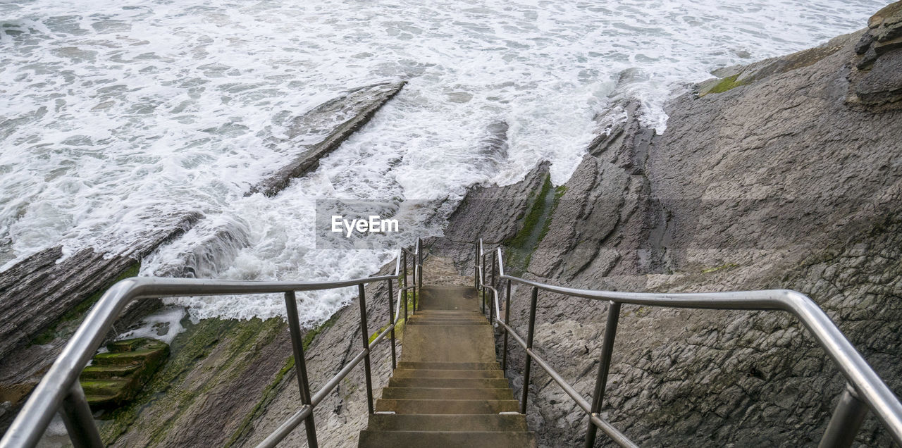 High angle view of steps by sea