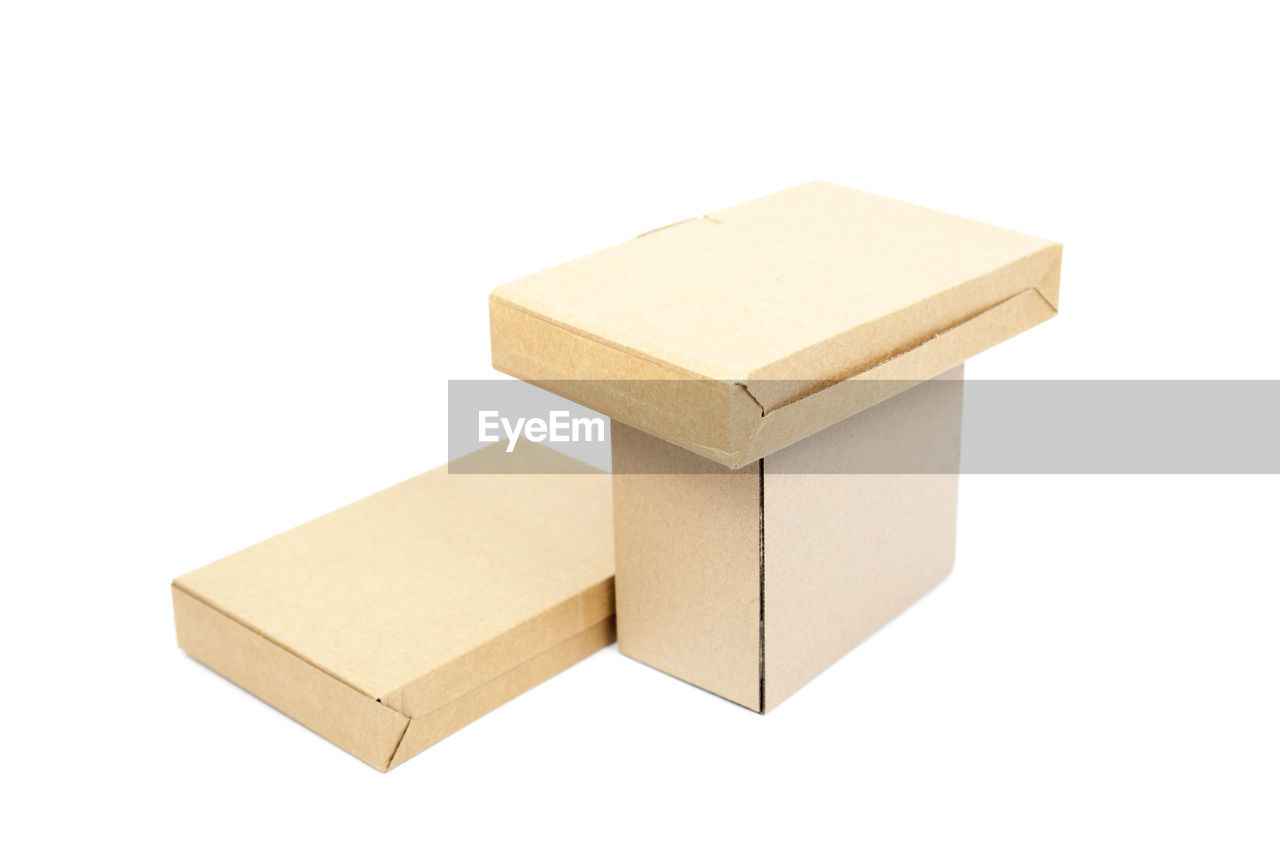 cut out, box, white background, cardboard, home ownership, container, wood, indoors, cardboard box, rectangle, single object, no people, white, furniture, copy space, package, studio shot, industry, business, lighting