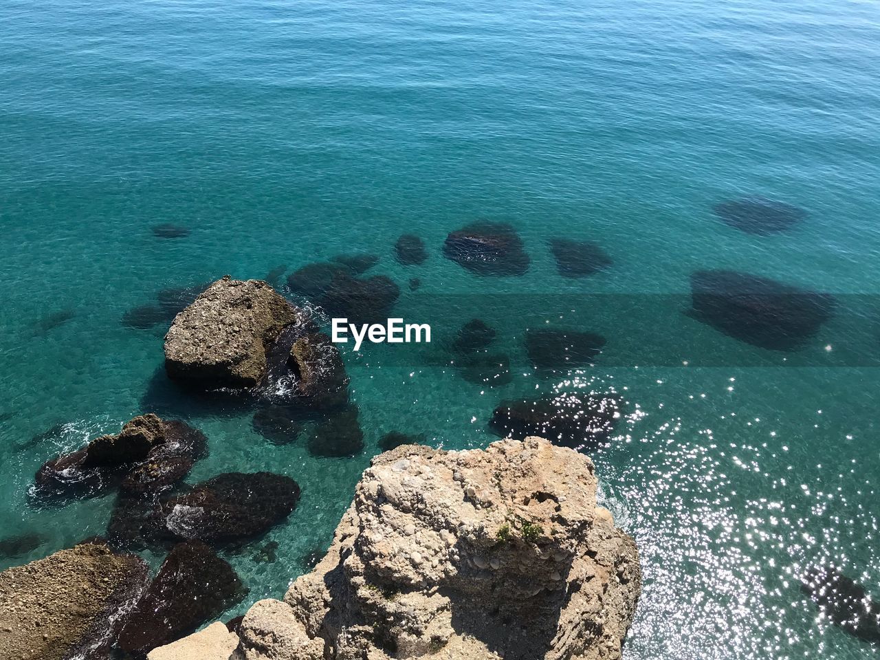 High angle view of rock formation in sea