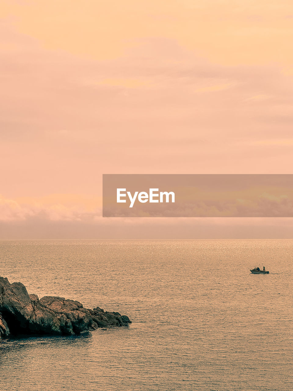 water, sea, sky, sunset, beauty in nature, horizon, scenics - nature, tranquility, shore, nature, tranquil scene, ocean, coast, nautical vessel, body of water, horizon over water, cloud, dawn, no people, idyllic, land, transportation, beach, outdoors, orange color, travel, waterfront, rock, bay, wave, seascape, travel destinations, non-urban scene, sand, mode of transportation, environment