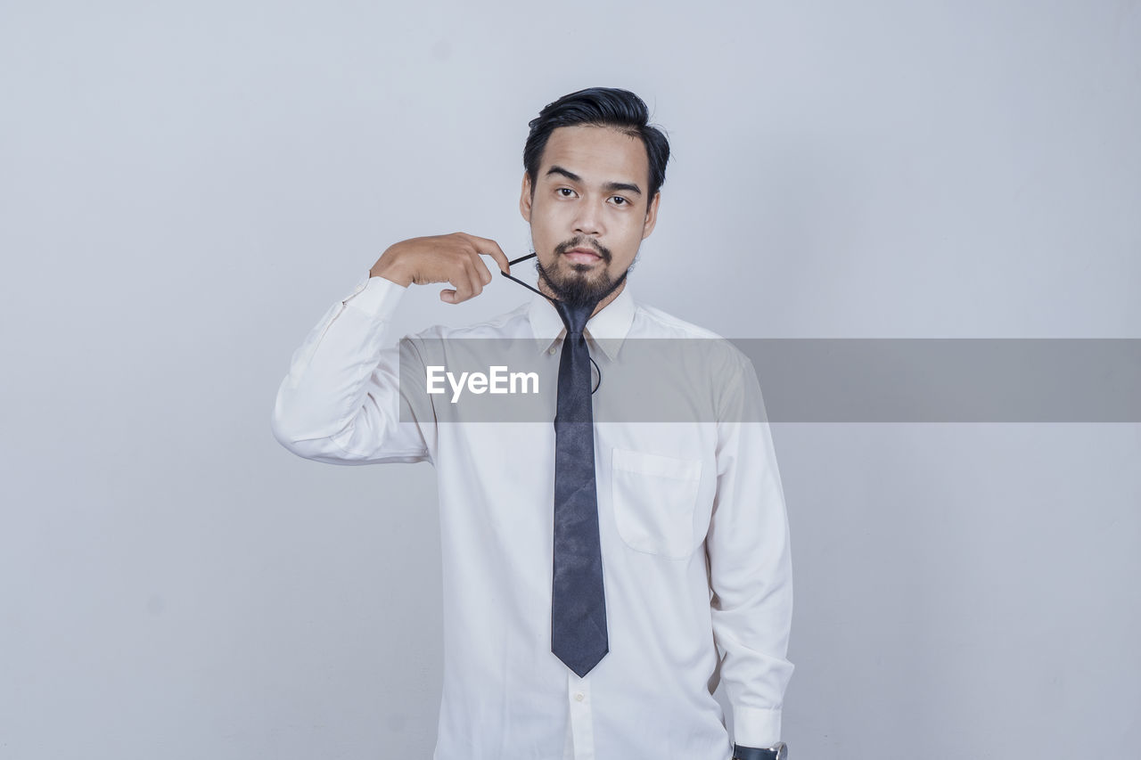 Funny facial expression with a suit and office shirt