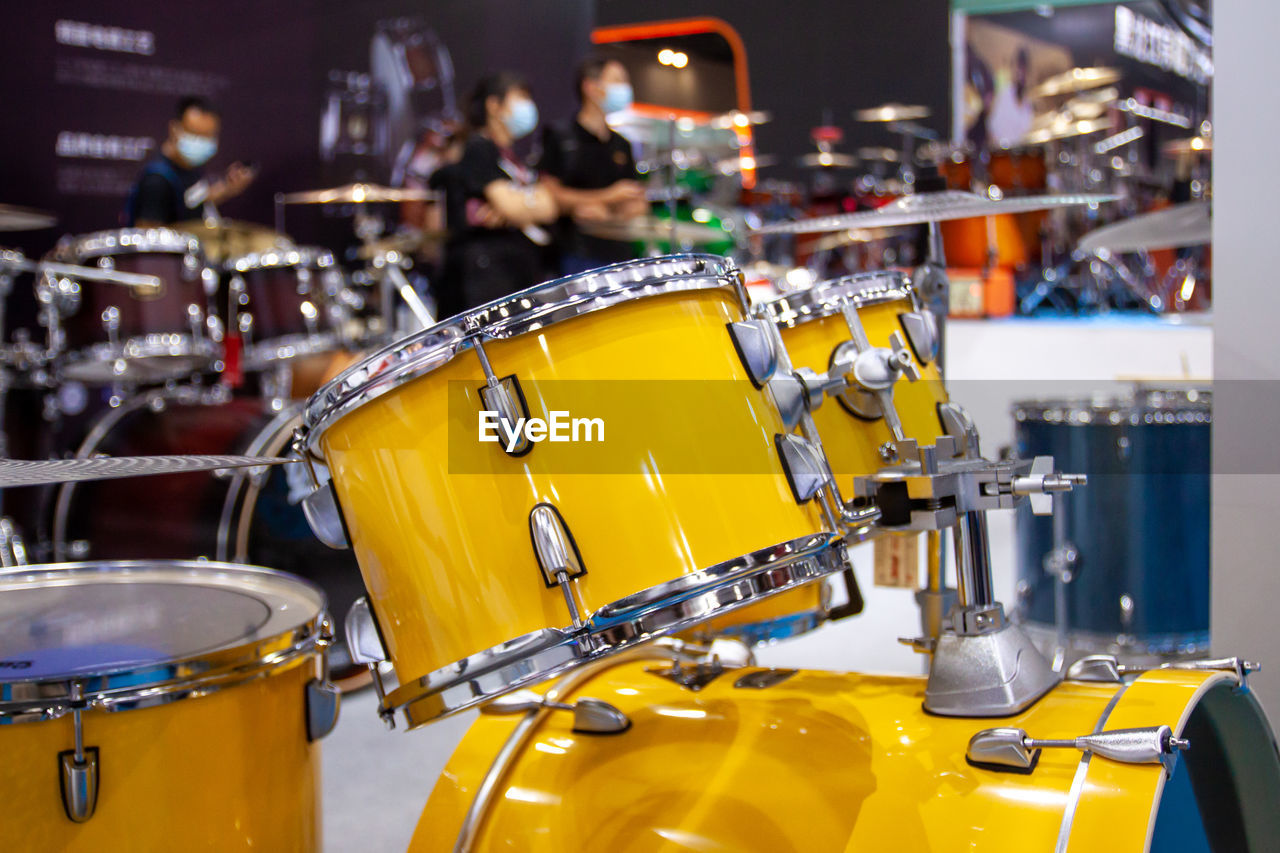 Set of new modern yellow drums in the studio, professional drums