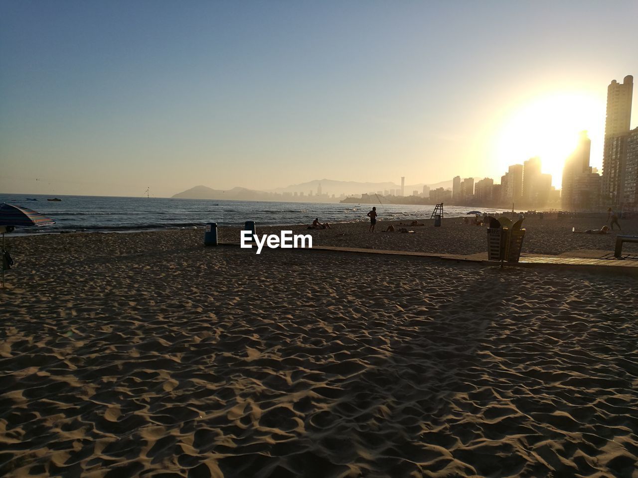 Scenic view of beach against clear sky