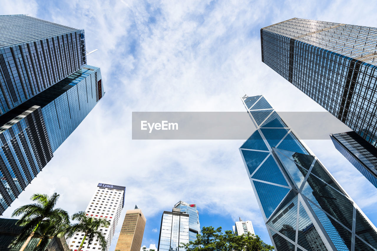 LOW ANGLE VIEW OF BUILDINGS AGAINST SKY IN CITY