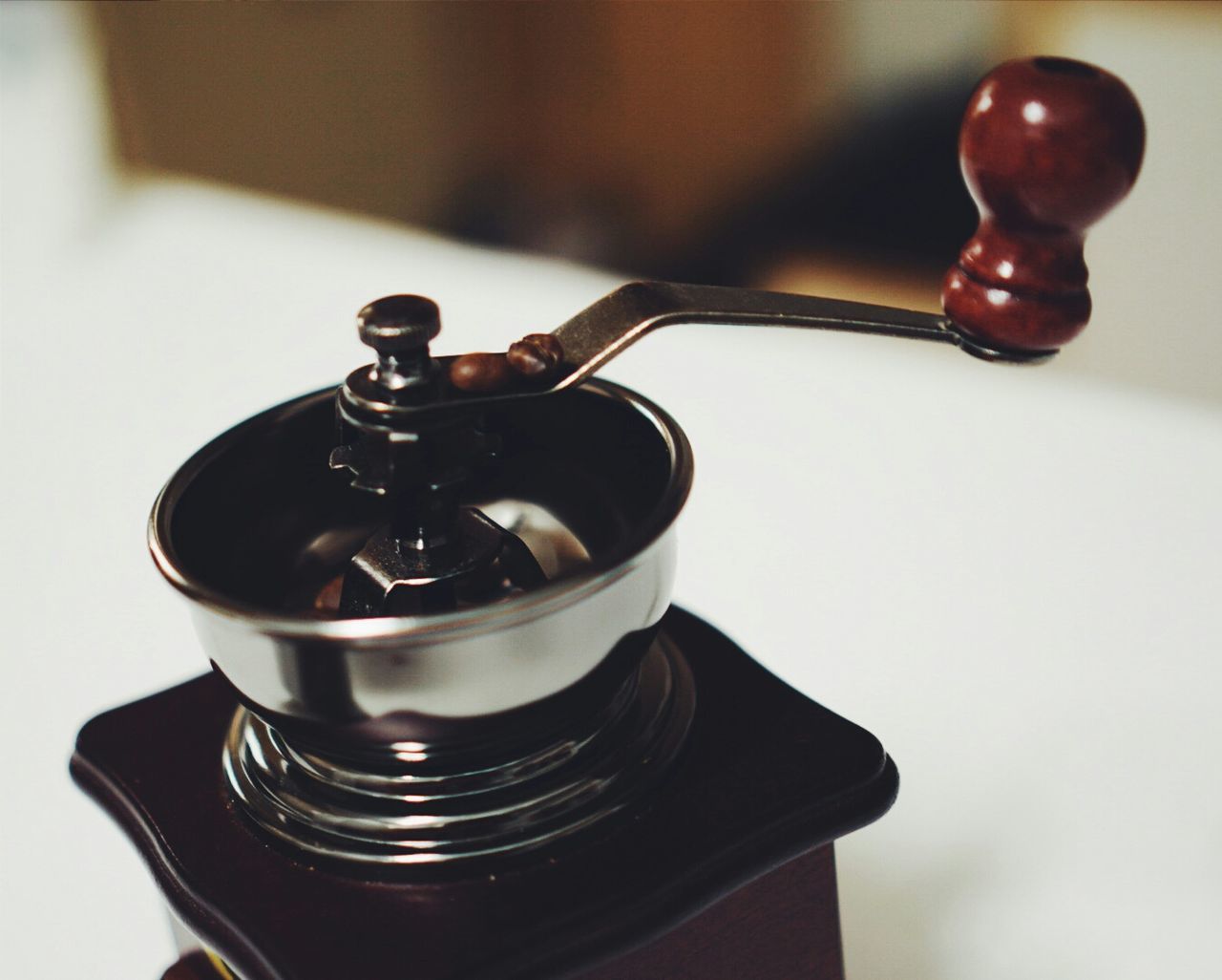 Close-up of coffee grinder on table at home
