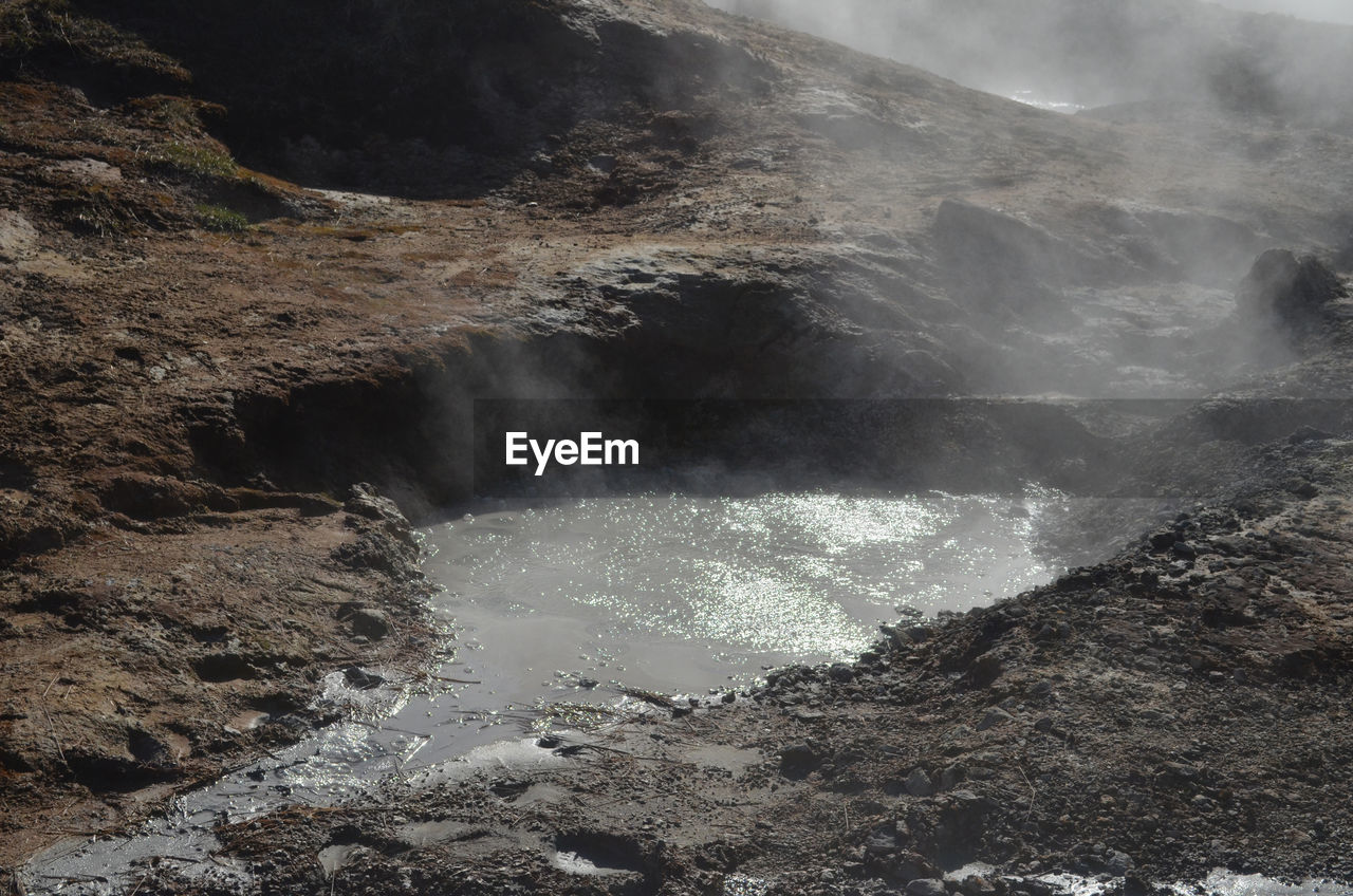 Scenic bubbling and boiling mud in a volcanic landscape in iceland.