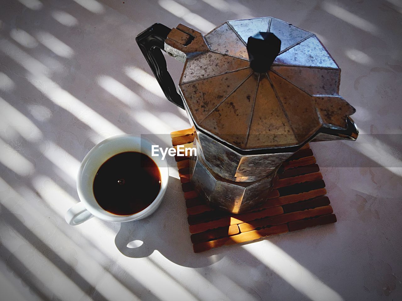 High angle view of pot and coffee on table