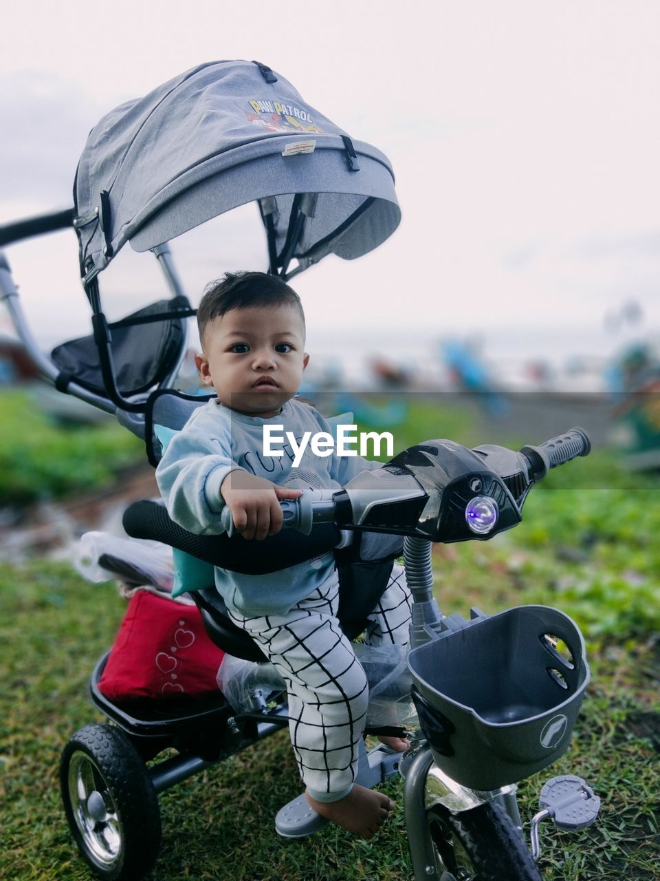 Portrait of boy riding push scooter