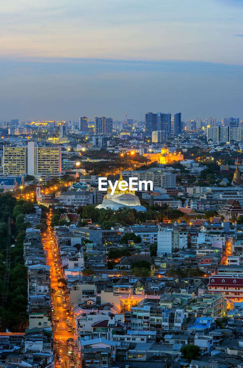 High angle view of illuminated buildings in city