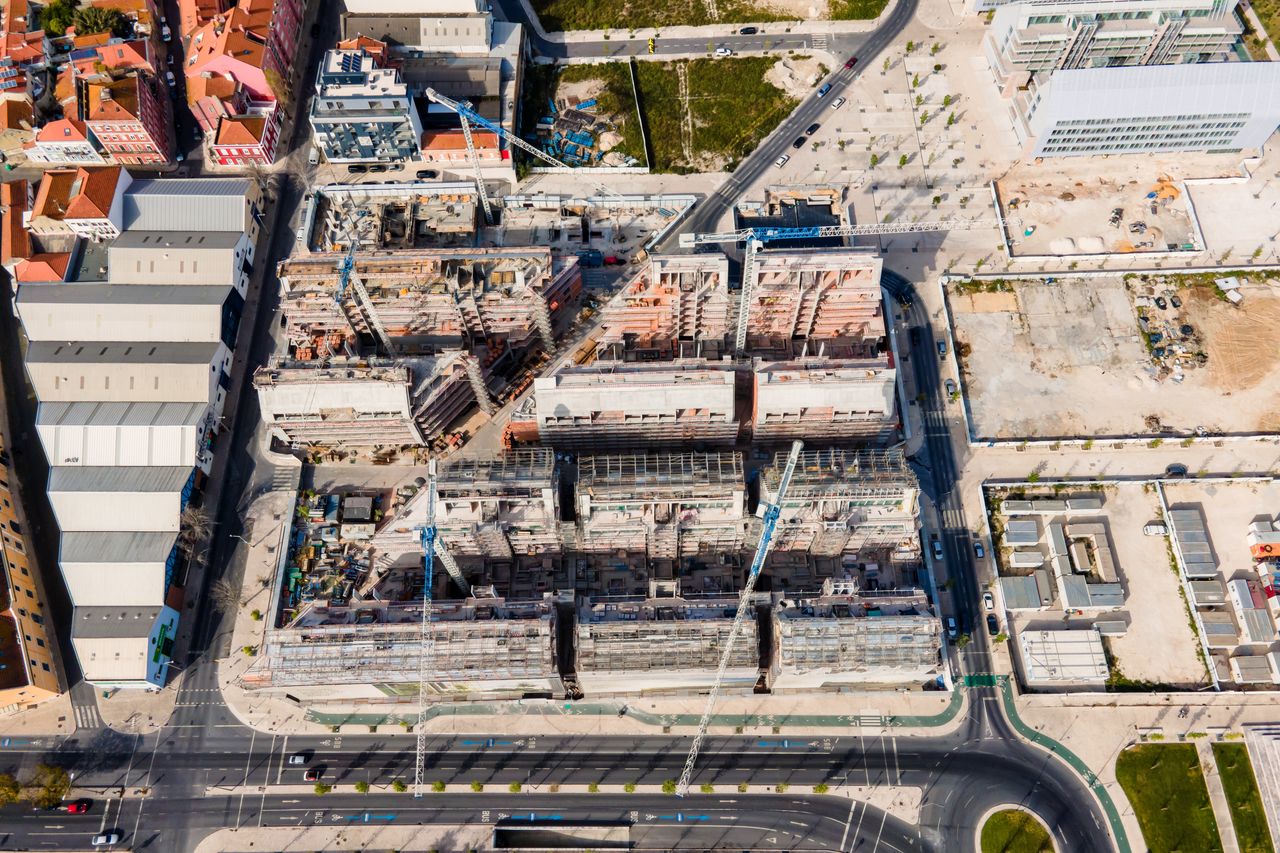 Aerial view of an enormous construction site along tagus riverside in lisbon city center, portugal.