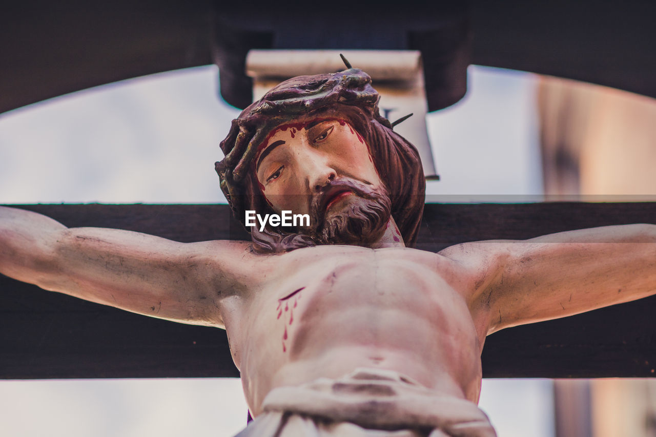 Low angle view of jesus christ crucified statue