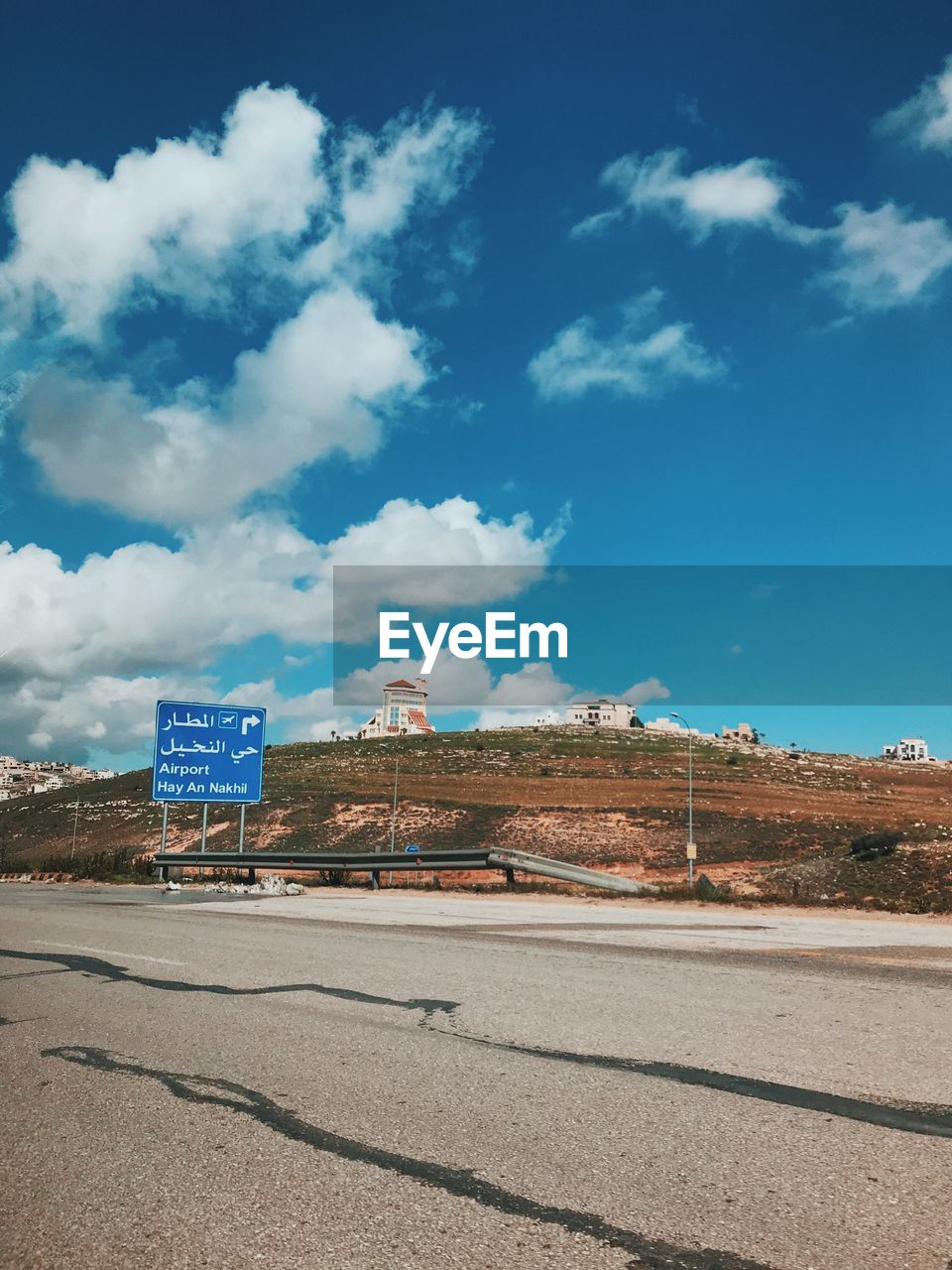 ROAD SIGN AGAINST SKY