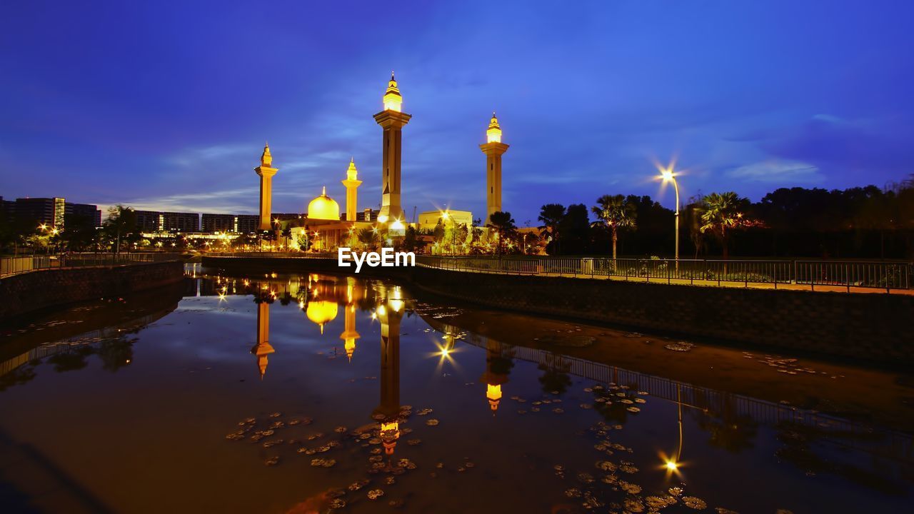 Reflection of illuminated buildings in water