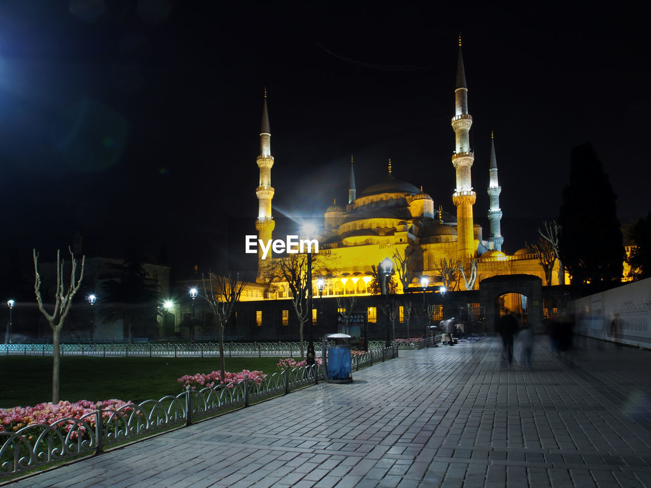 Low angle view of illuminated blue mosque at night