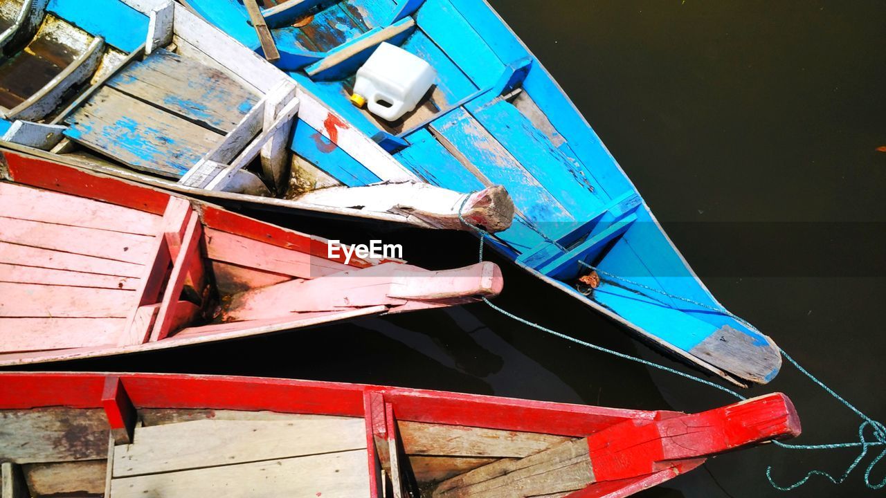 High angle view of boats moored at harbor