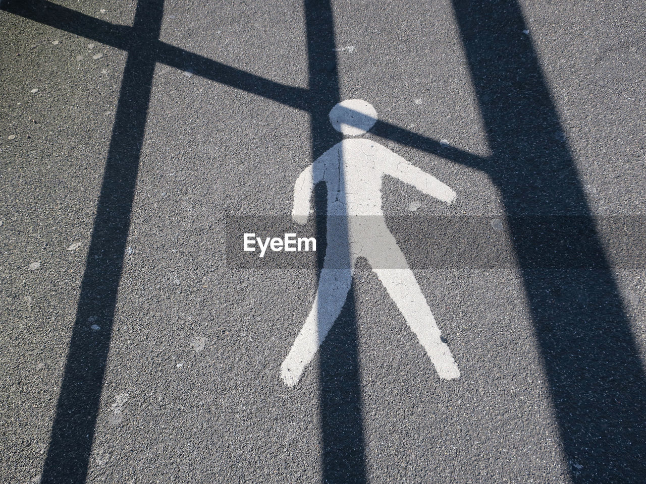 HIGH ANGLE VIEW OF SHADOW ON STREET