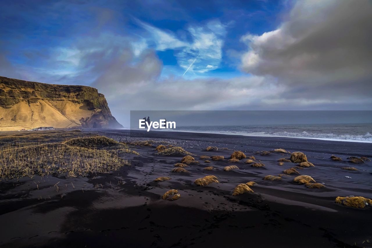 Scenic view of beach against sky