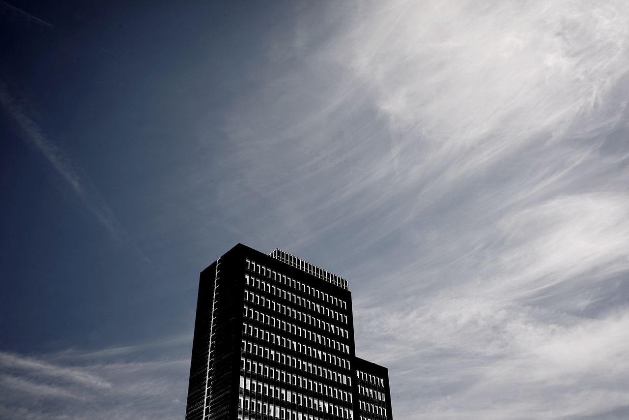 LOW ANGLE VIEW OF MODERN BUILDINGS AGAINST SKY