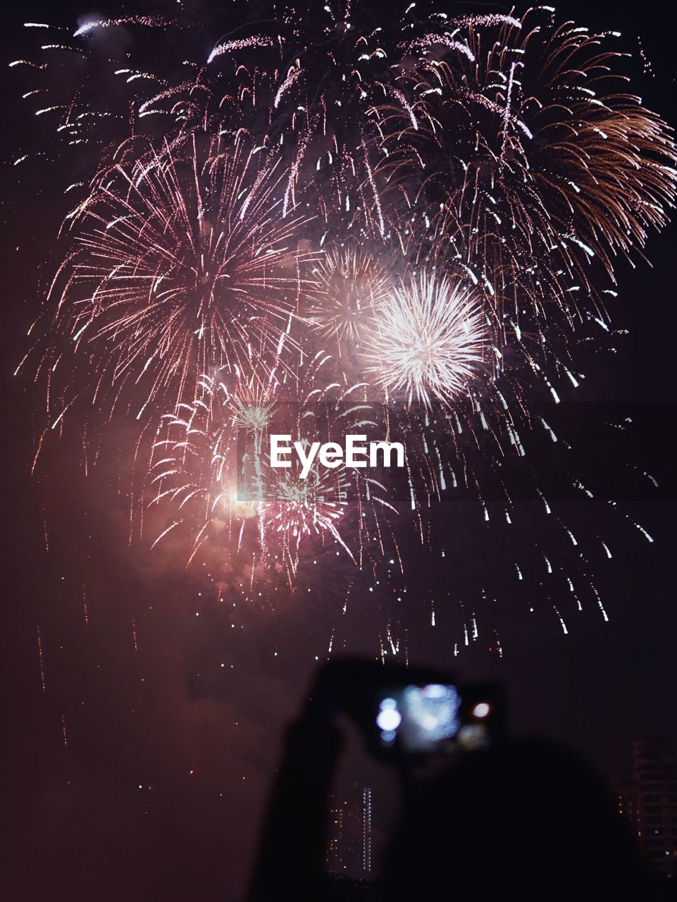 LOW ANGLE VIEW OF FIREWORK DISPLAY