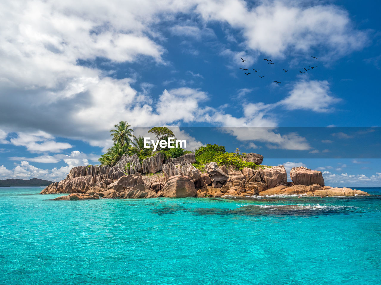 Scenic view of an island against sky