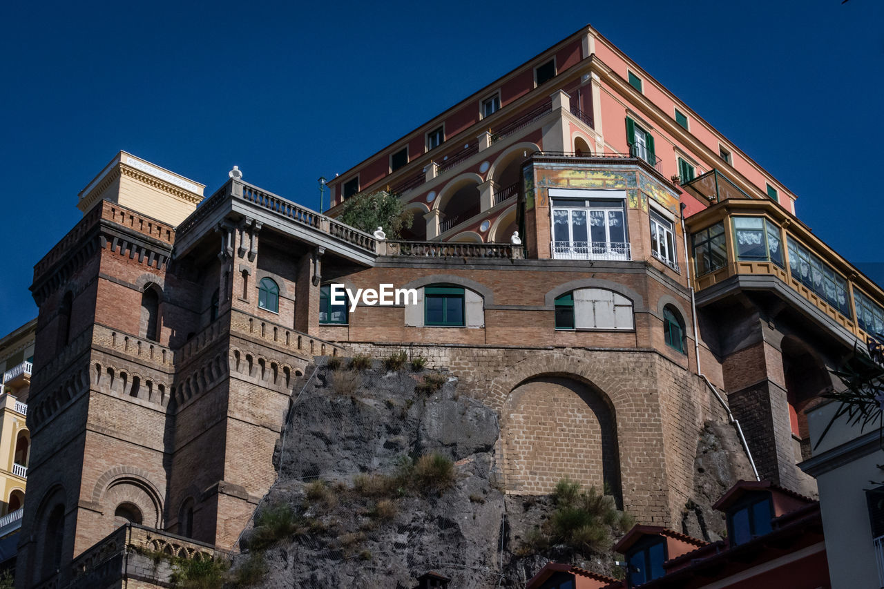 LOW ANGLE VIEW OF RESIDENTIAL BUILDING