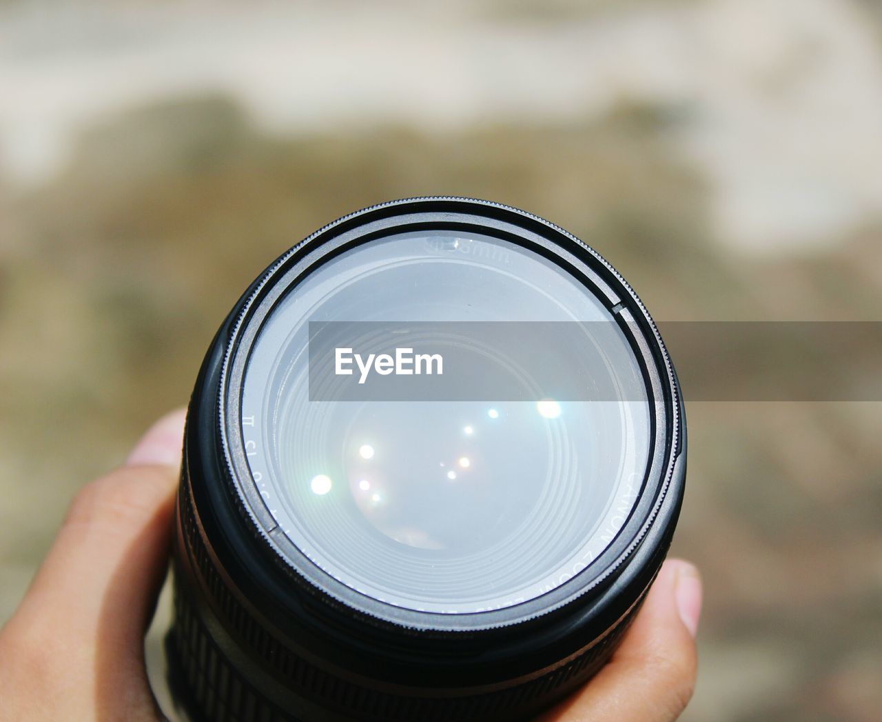 Cropped image of person holding camera