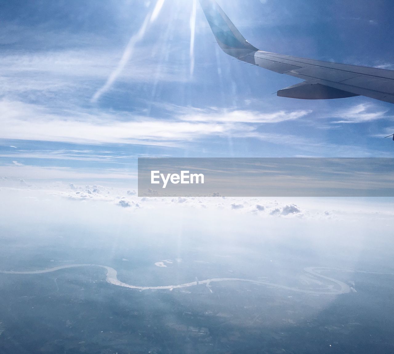 AERIAL VIEW OF AIRCRAFT WING OVER SEA