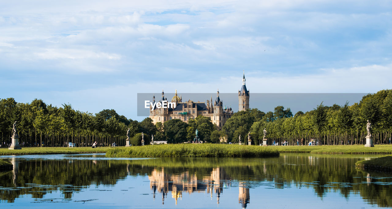 Schwerin castle and lake against cloudy sky