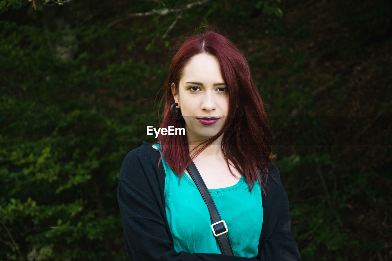 Portrait of beautiful woman with redhead