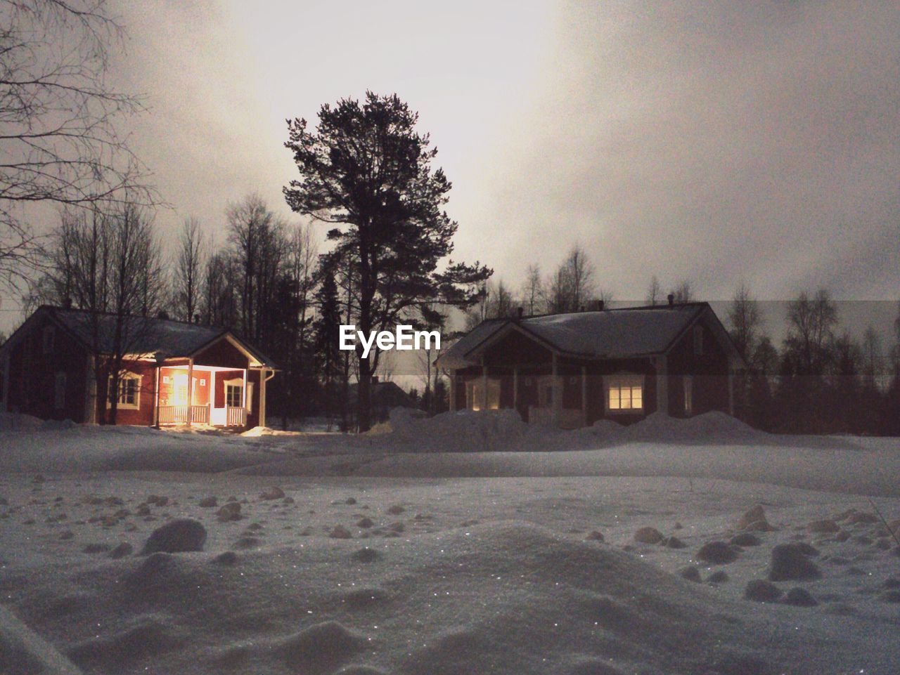 Scenic view of houses and snow