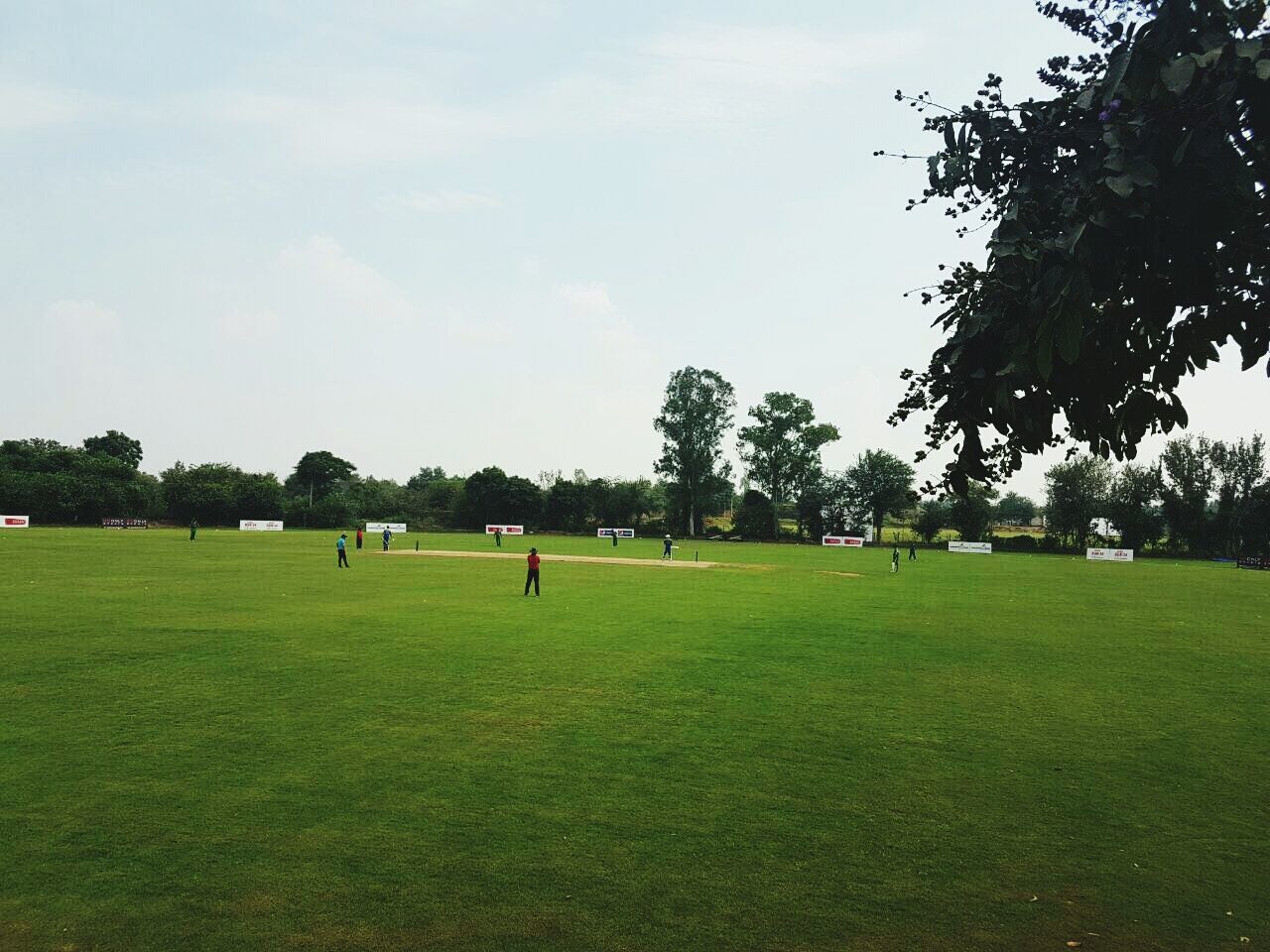 PEOPLE ENJOYING ON GOLF COURSE