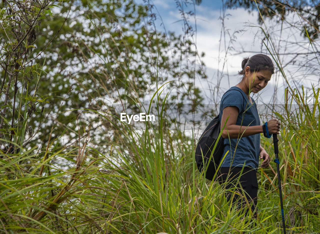 Woman hiking up adam's peak close to ella in sri lanka