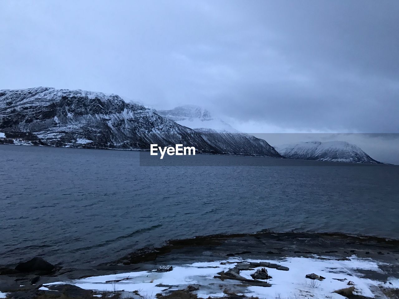 Scenic view of frozen lake against sky