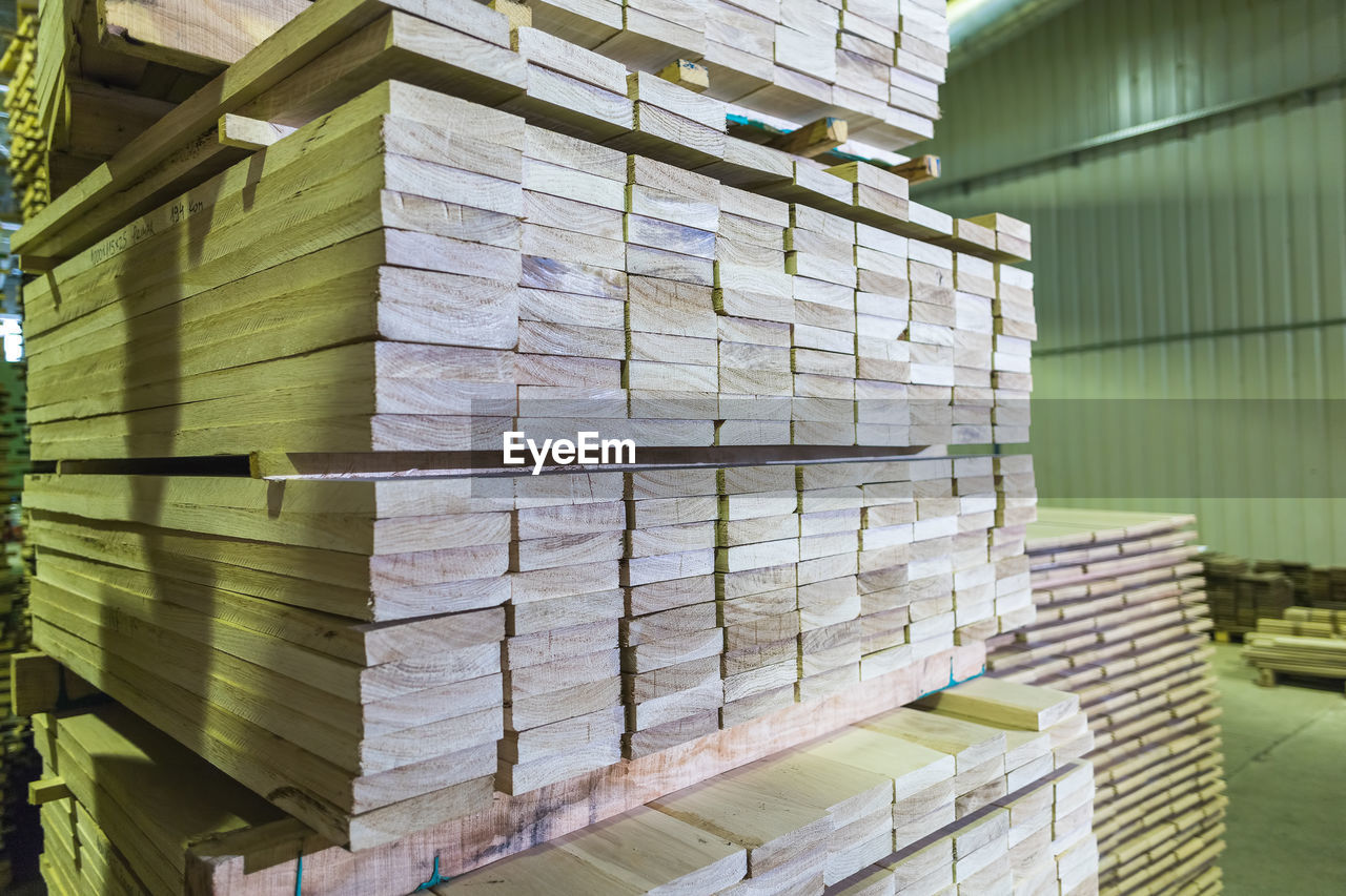 Wood flooring planks stored in wood processing factory