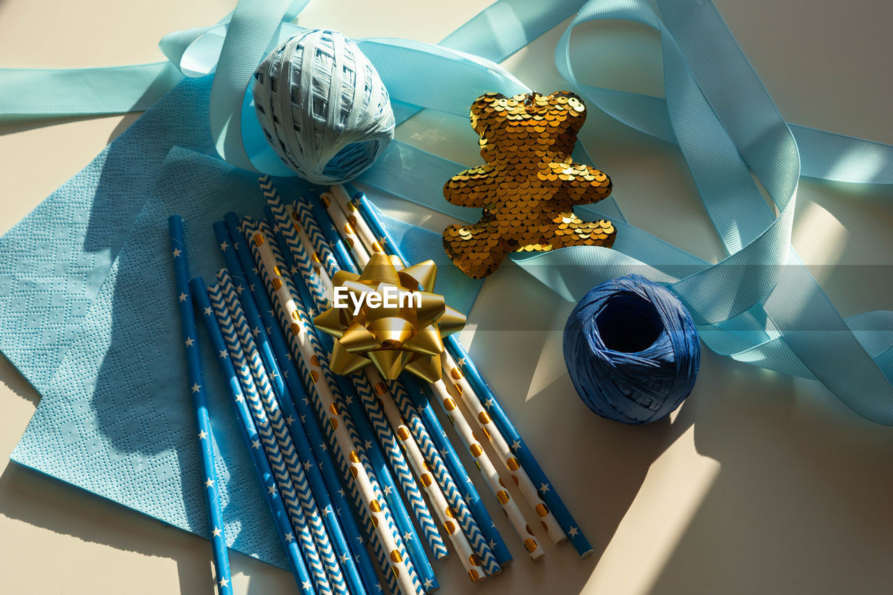 Top view blue and golden colors decor for gender reveal party, newborn baby shower. boy's birthday.