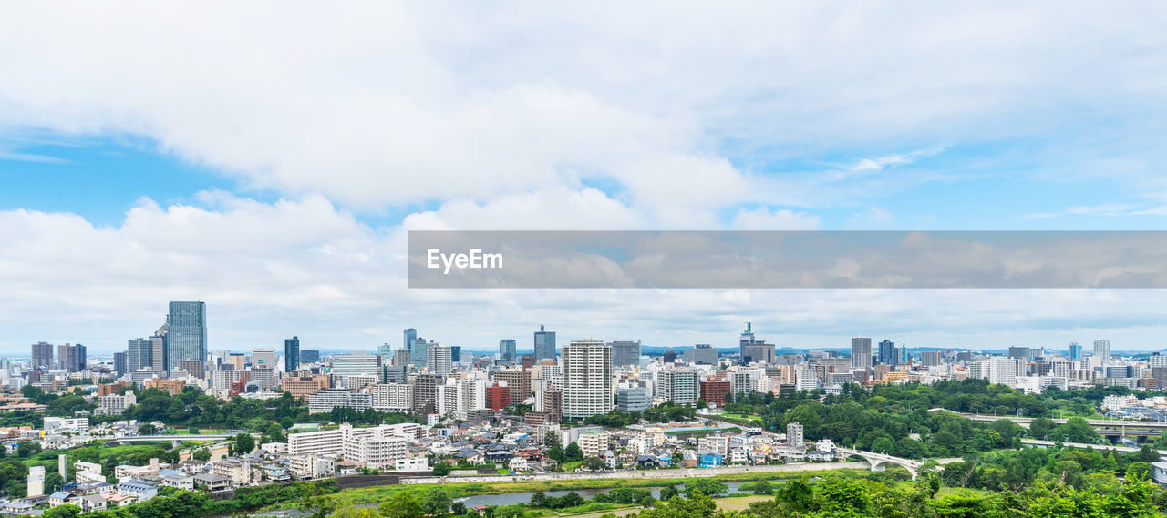 VIEW OF BUILDINGS IN CITY AGAINST SKY