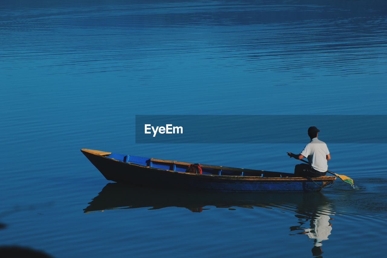 Man on boat in river