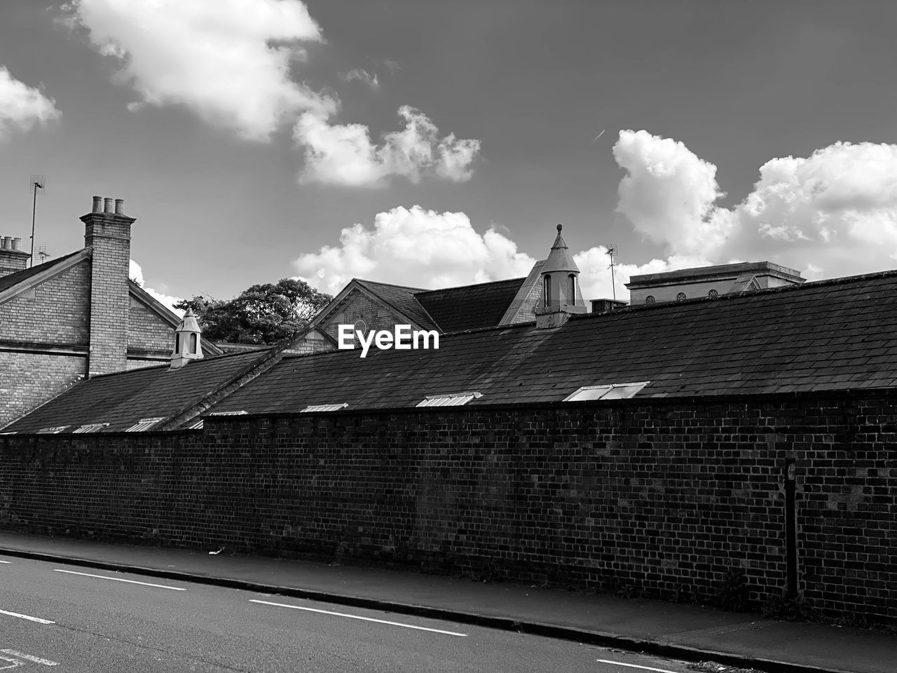 Buildings against cloudy sky