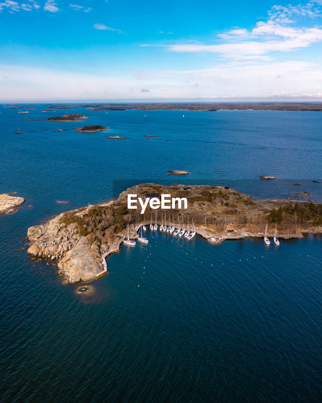 Small island with a sailboat harbor in finland