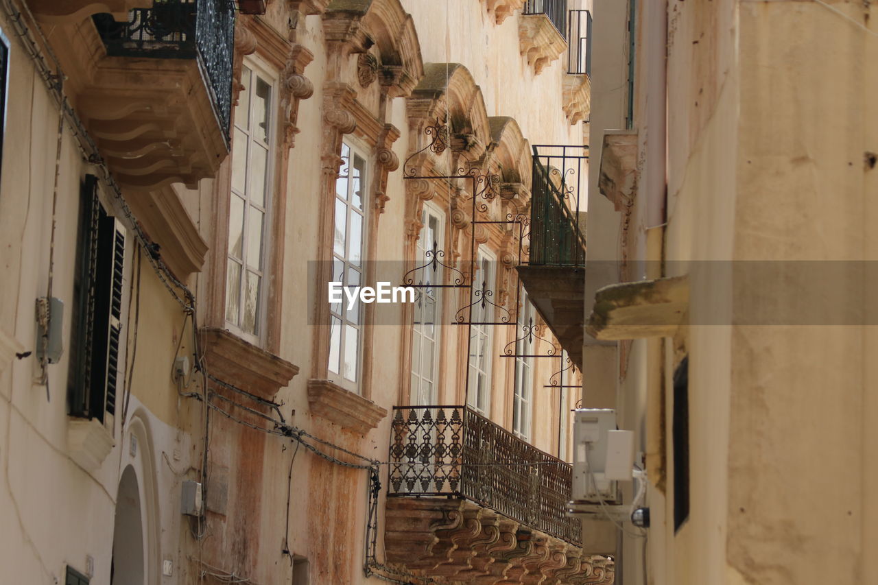 architecture, built structure, building, building exterior, no people, ancient history, facade, history, the past, worship, low angle view, day, religion, place of worship, travel destinations, pipe organ, outdoors