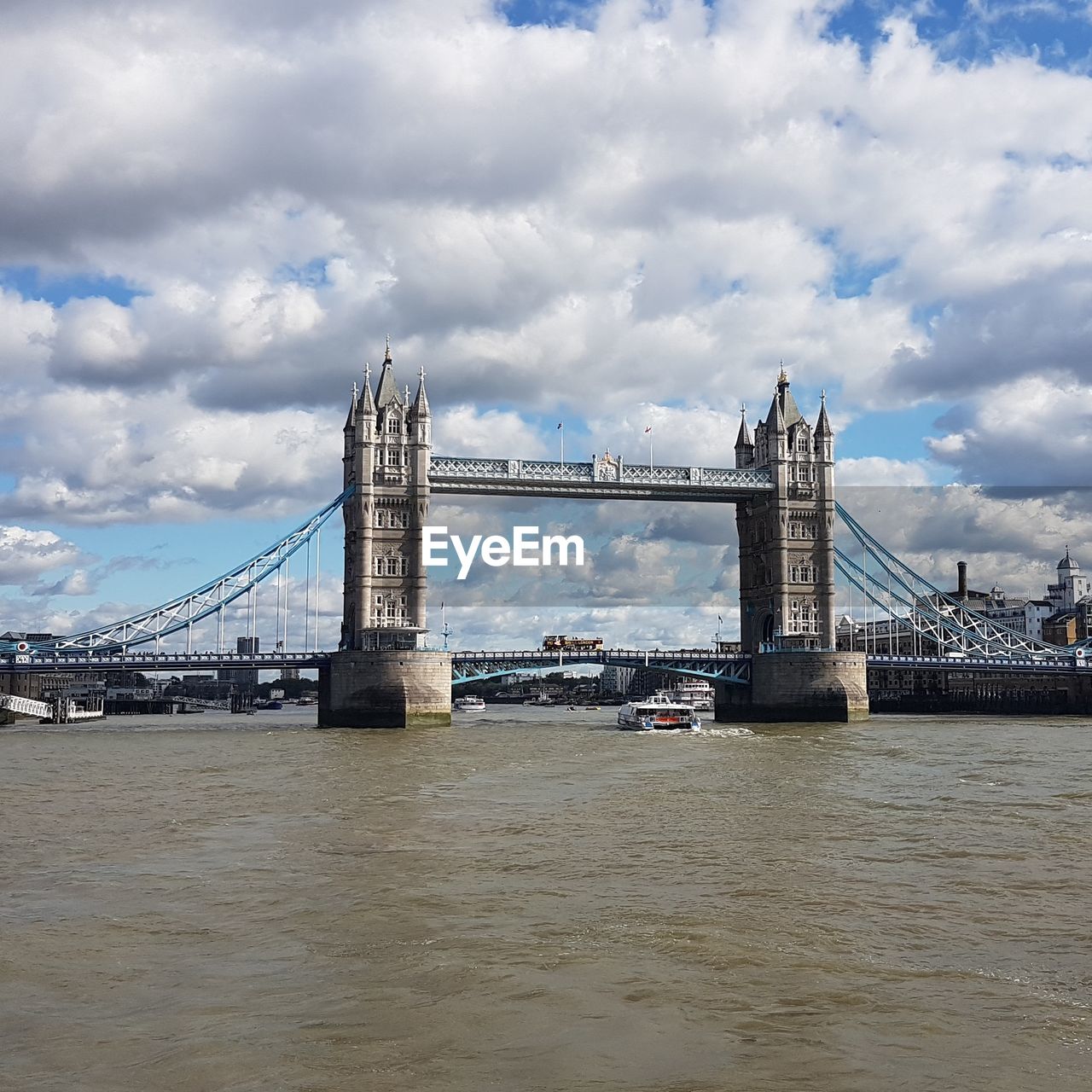 View of bridge over river against cloudy sky