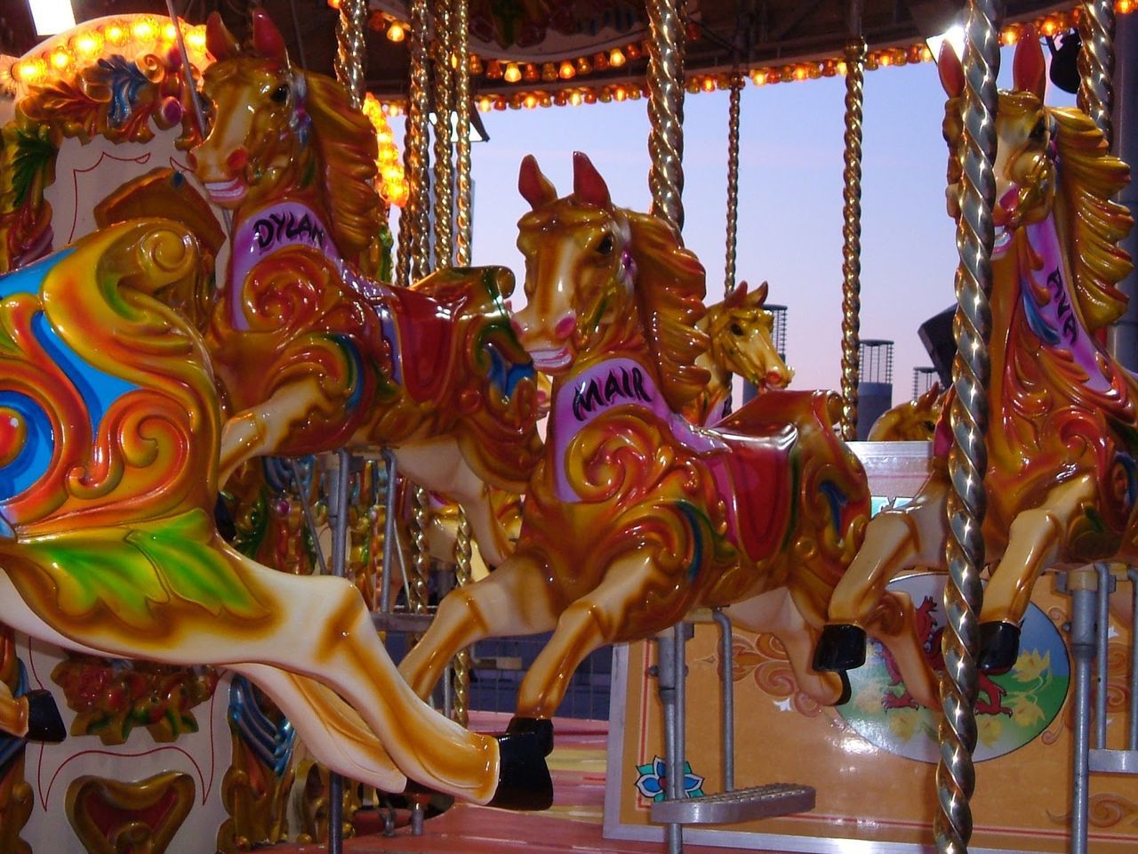 VIEW OF CAROUSEL IN AMUSEMENT PARK