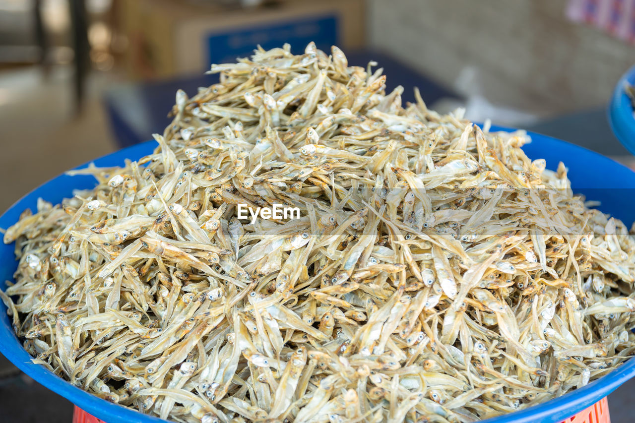 Group of small sea fish dried for sale to tourists in the market.