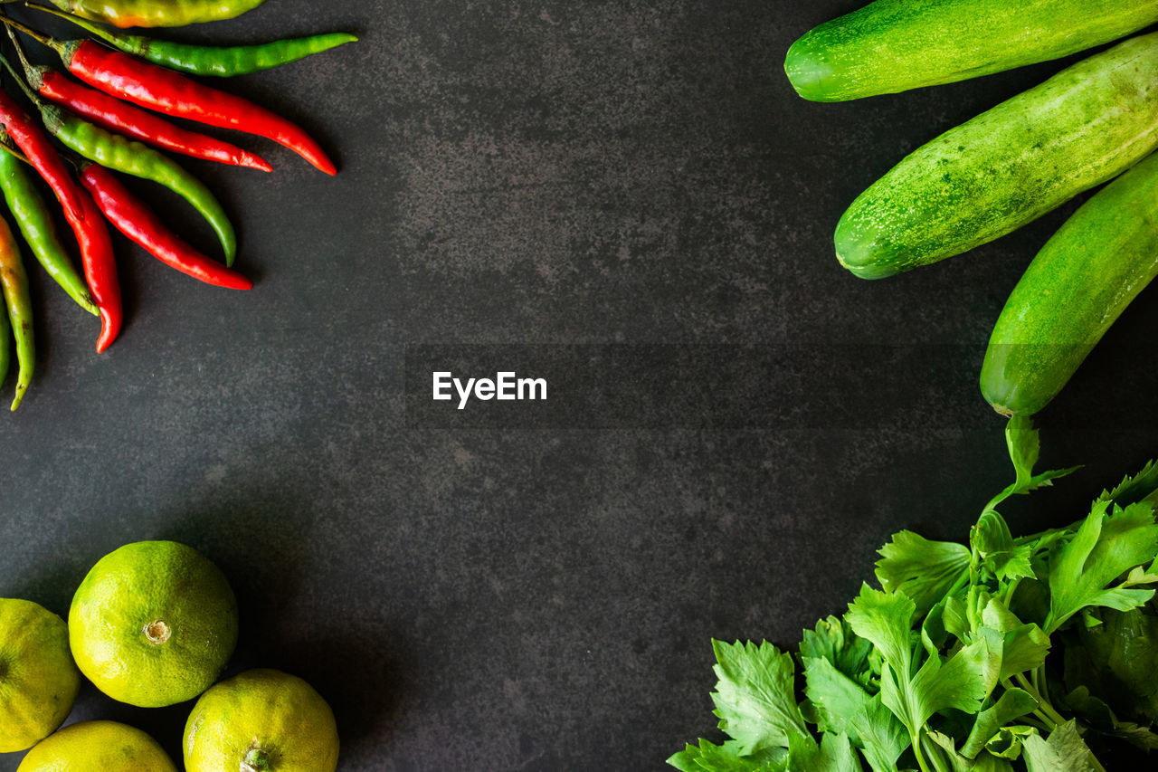 HIGH ANGLE VIEW OF GREEN CHILI PEPPERS