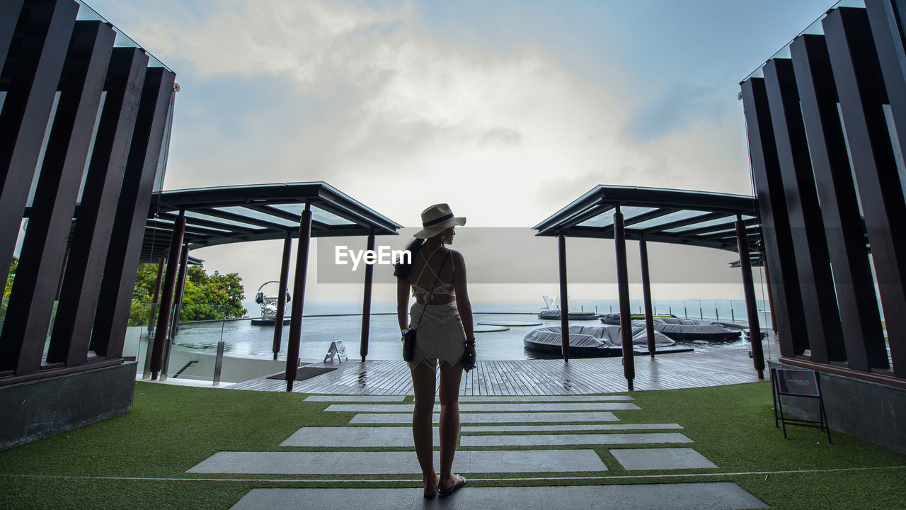 Silhouette of woman looking at sea