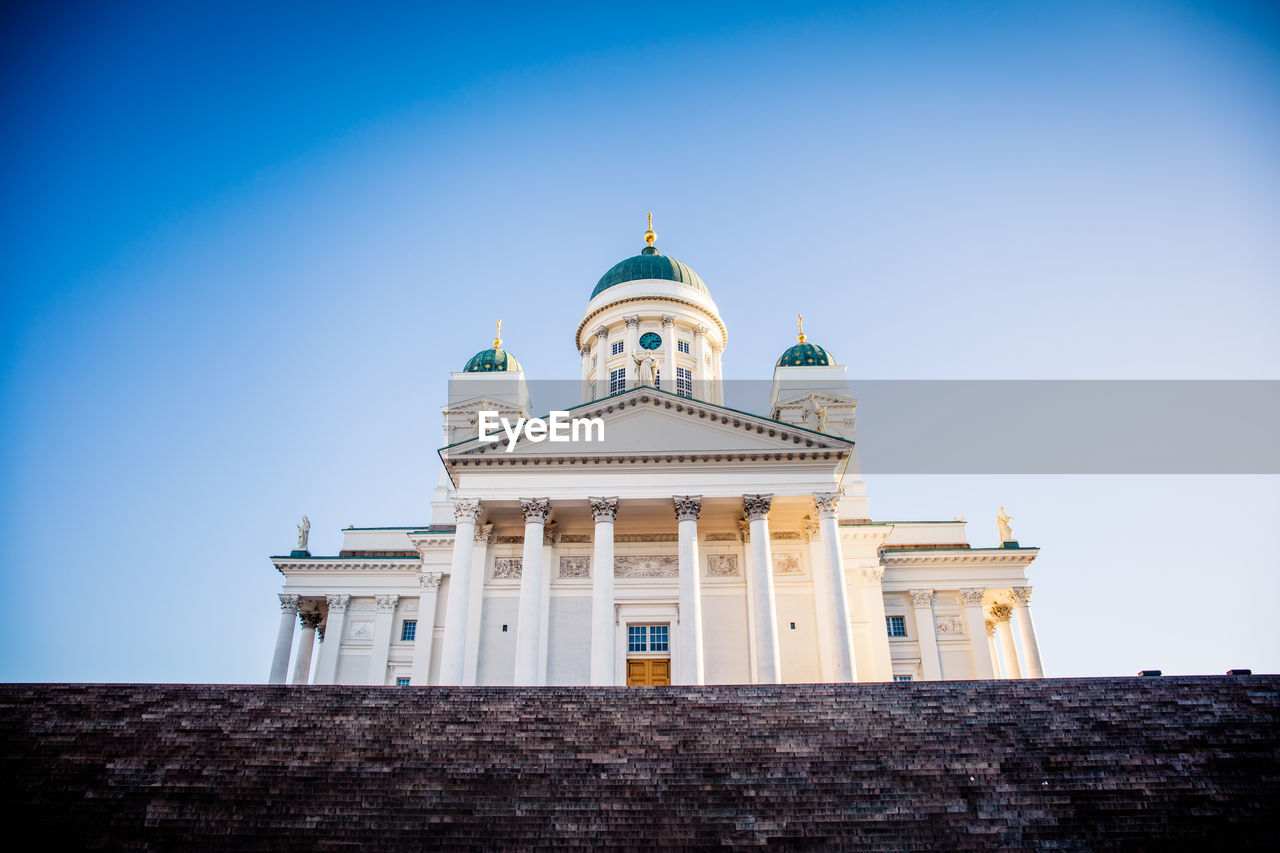 Low angle view of building against clear blue sky