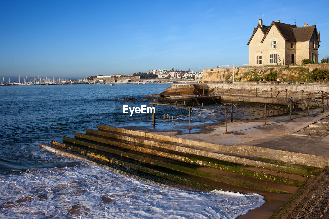 Scenic view of sea against clear blue sky